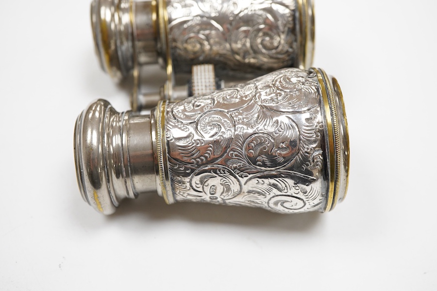 A pair of late Victorian repousse silver mounted plated brass opera glasses, Henry Charles Kelly, Birmingham, 1900, 8.8cm by 11.6cm.